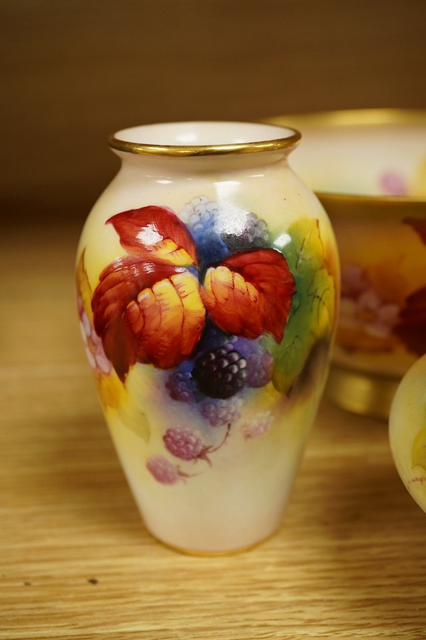 Four pieces of Royal Worcester porcelain hand painted with fruit and flowers by Kitty Blake, largest 18cm wide. Condition - good, bowl with hairline crack